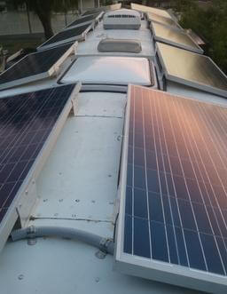 Rigid solar panels on converted coach