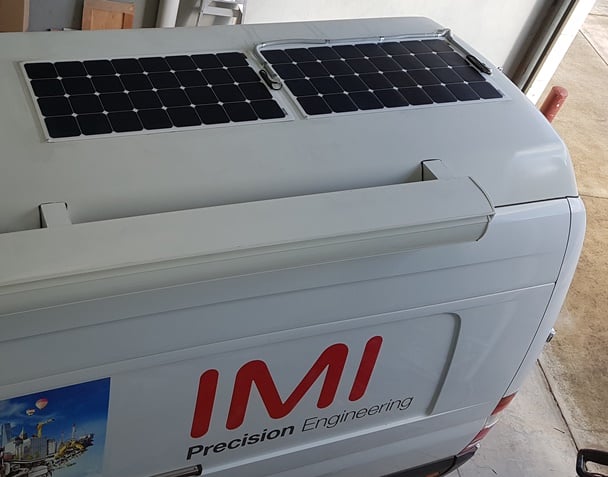 Display parts van with lightweight low-profile solar on the roof