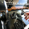Scanstrut Ultra Qi2 wireless charger installed beside the controls on a boat dashboard