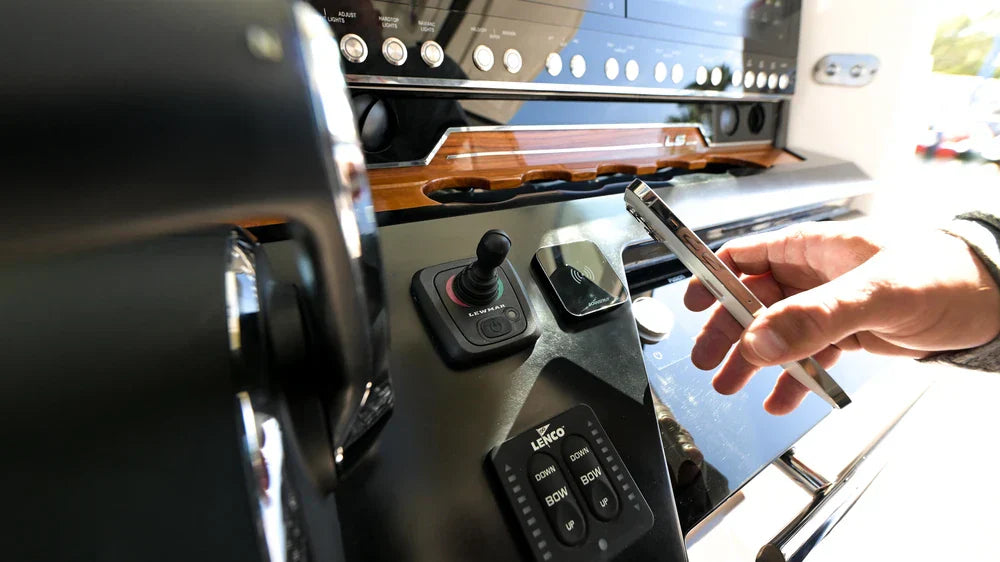 Scanstrut Ultra Qi2 wireless charger installed beside the controls on a boat dashboard