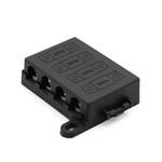 Angled view of black 4-way midi fuse holder with protective cover and mounting tabs