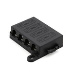 Angled view of black 4-way midi fuse holder with protective cover and mounting tabs