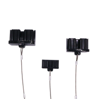 Three black Anderson plug dust covers in different sizes with steel lanyards