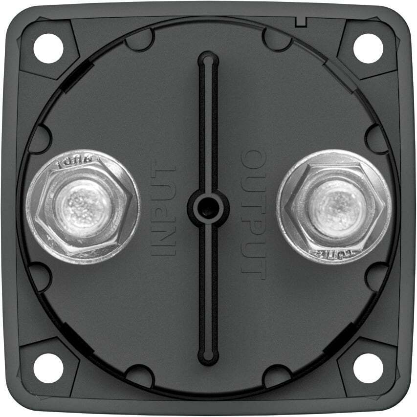 Rear housing of battery switch displaying two terminal studs, retaining nuts and molded input output markings