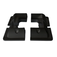 Four black ABS plastic solar panel corner brackets showing aerodynamic profile and internal mounting recesses