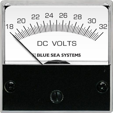 Analog micro DC voltmeter with a white face showing a scale from 18 to 32 volts