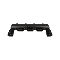 Angled side view of the black protective busbar cover with cable entry cutouts