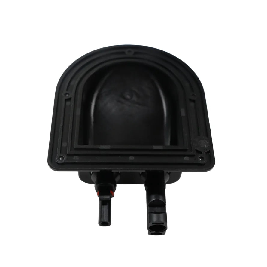 Underside of black plastic housing showing internal cavity and mounting flange