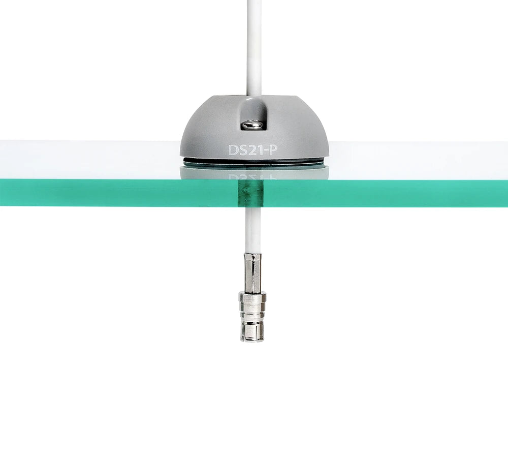 Side view of a cable seal on clear glass showing a connector passing through the base