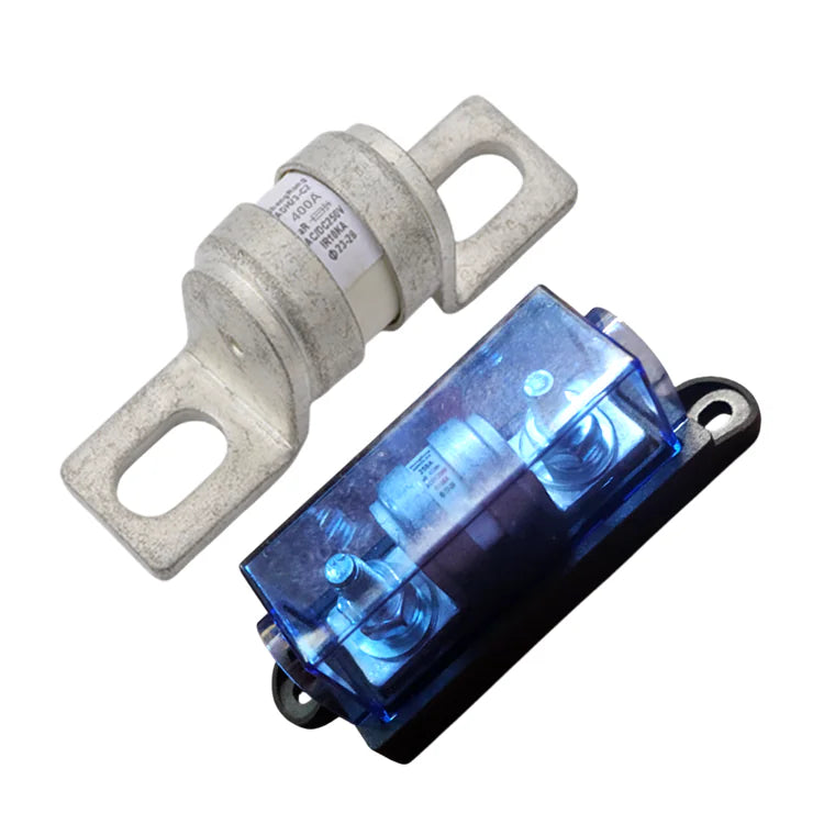 Exotronic 400A ceramic fuse next to a black fuse holder with a blue transparent cover and bolt terminals