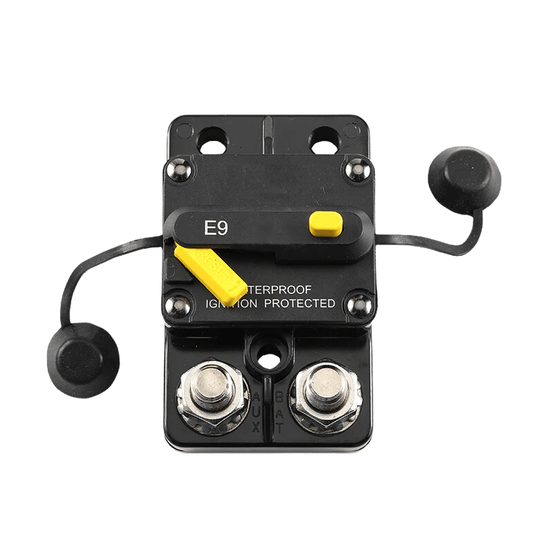 Overhead view of waterproof DC circuit breaker with protective stud caps unattached