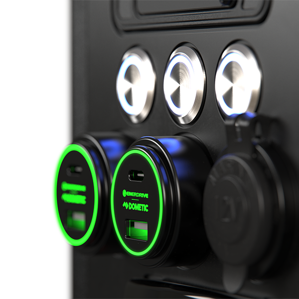 Close-up of two green illuminated 100W USB sockets and a 12V marine-grade cigarette socket
