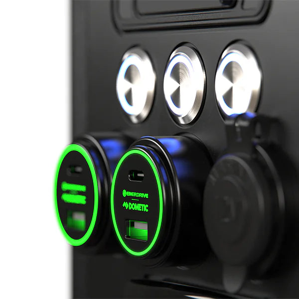 Close-up of two green illuminated 100W USB sockets and a 12V marine-grade cigarette socket