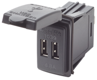 Dual USB switch-mount DC power outlet with protective dust cap open showing two USB ports