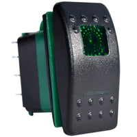 Black 3-position DPDT rocker switch with green illumination window and 7-pin base