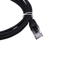 Close-up of black ethernet cable end showing the strain relief boot and RJ45 connector back
