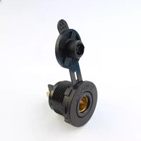 Angled view of black flush mount Merit socket with open dust cap and threaded body