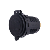 Black flush mount USB socket with protective rubber cover closed over the face