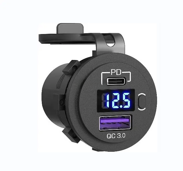 Angled view of black socket showing USB-C PD port, blue digital voltmeter, power button and QC 3.0 USB-A port