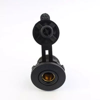 Front view of Exotronic Merit socket showing brass internal contacts and open protective cover