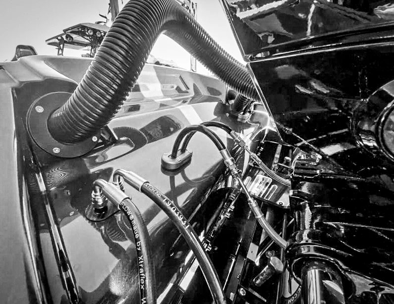 Black and white view of the cable seal in a boat engine compartment