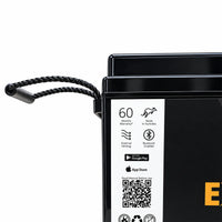 Close-up of the battery's heavy-duty rope handle and side specification label