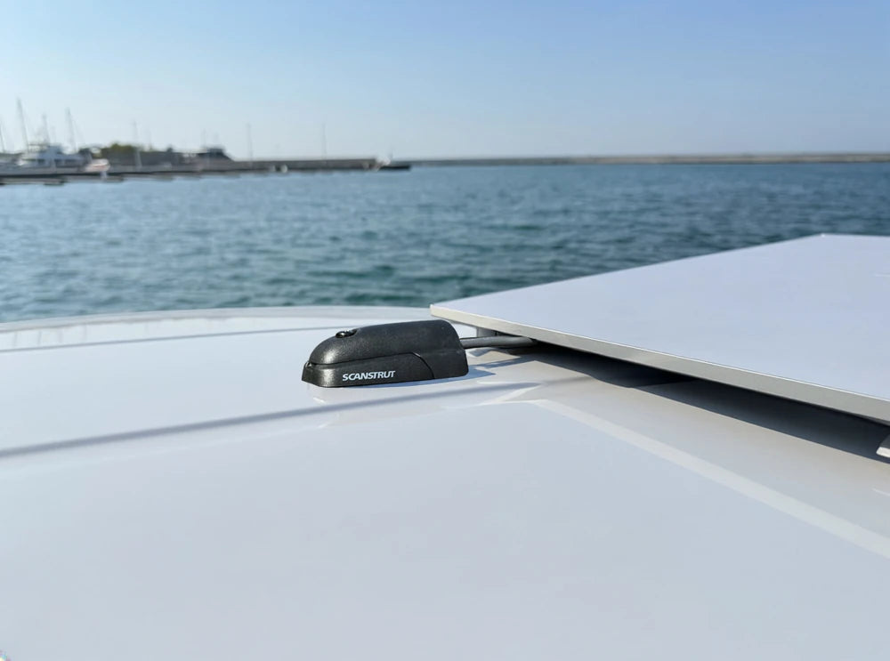 Marine cable seal installed on a white deck in a coastal environment