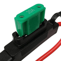 Green 30A maxi blade fuse being inserted into Exotronic fuse holder