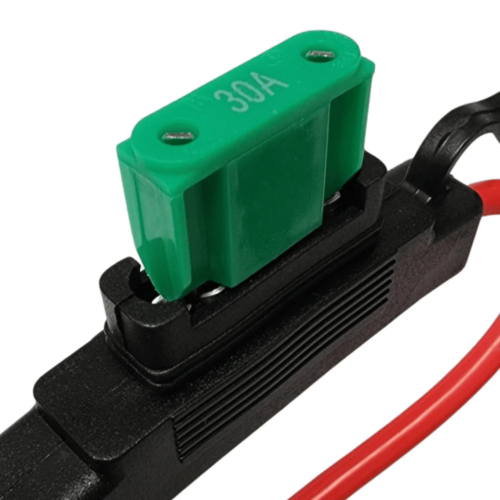 Green 30A maxi blade fuse inserted into black inline fuse holder