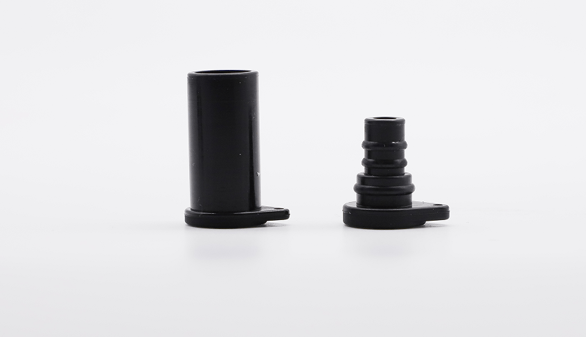 Black male and female solar connector dust caps standing side by side