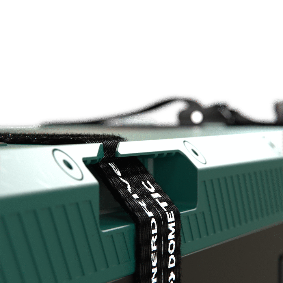 Close-up of heavy-duty mounting strap secured through integrated housing slots