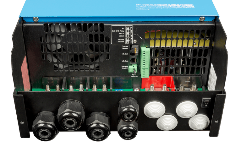 Internal view of MultiPlus-II connection area with AC terminals, DC bolts, and communication ports