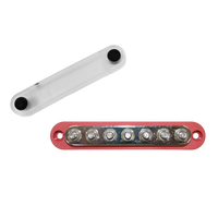 Red 150A busbar with 7 M6 studs and removed clear protective cover
