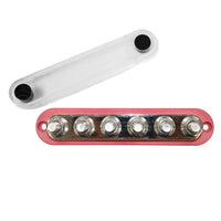 Red 300A busbar with six M10 studs and a detached clear protective cover next to it