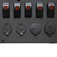 Close-up of rocker switches and waterproof caps on 12V and USB sockets