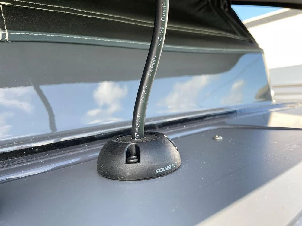 Detailed view of a waterproof cable seal entry point on a vehicle roof surface