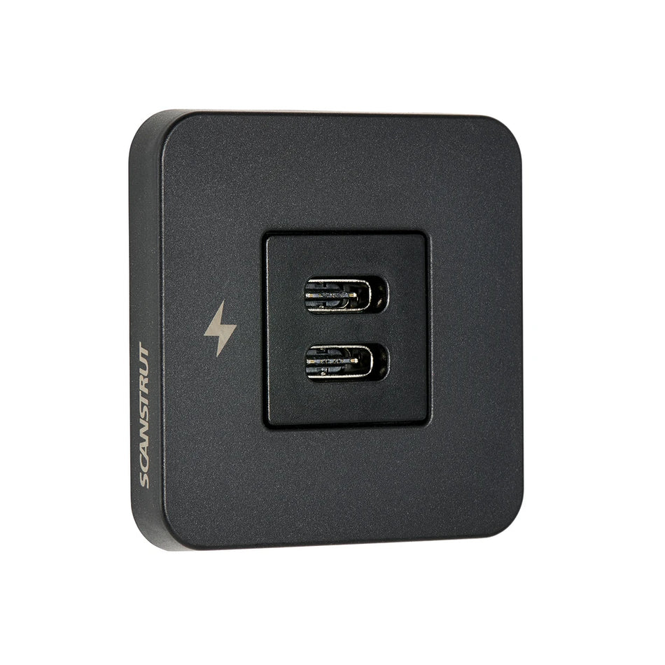 Angle view of black dual USB-C charging socket with square bezel and charging icon