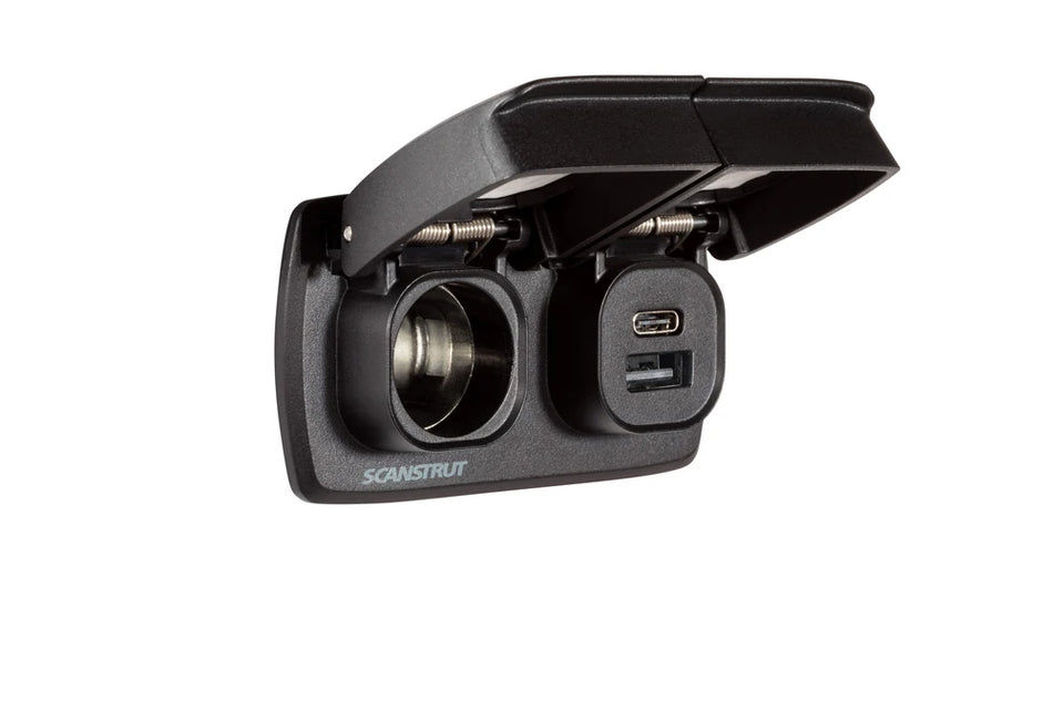 Dual 12V cigarette socket and USB charging ports with both spring-loaded lids open