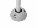 Grey vertical cable seal installed with white cable on a flat surface