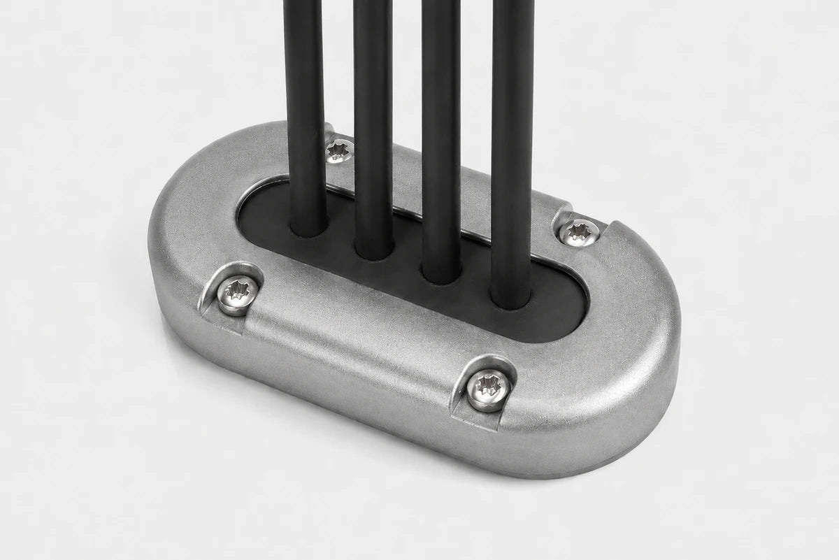 Aluminium vertical multi cable seal with four cables passing through a black rubber bung