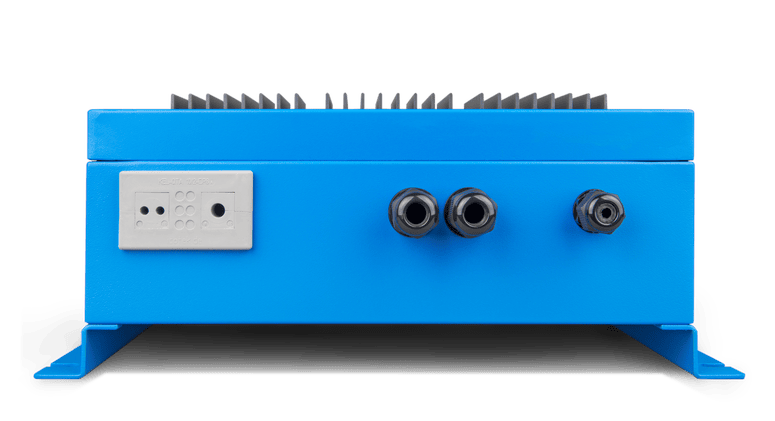 Bottom view of Skylla-IP65 charger showing cable glands and terminal block ports