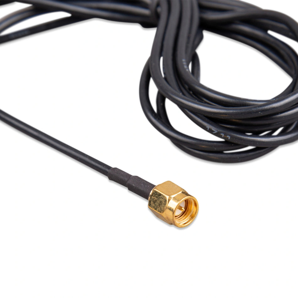 Close-up of a gold-plated SMA male straight connector on black coaxial cable