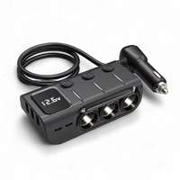 Studio shot of car adaptor showing digital display reading 12.6v and cable layout