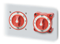 Two battery switches mounted on a grey panel demonstrating installation options