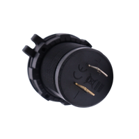 Rear view of socket housing showing positive and negative spade terminals and markings