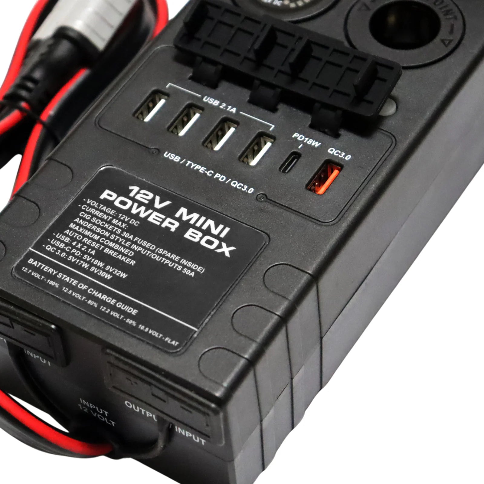 Close-up of power hub showing specification label and open USB charging ports