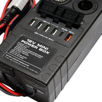 Close-up of power hub showing specification label and open USB charging ports
