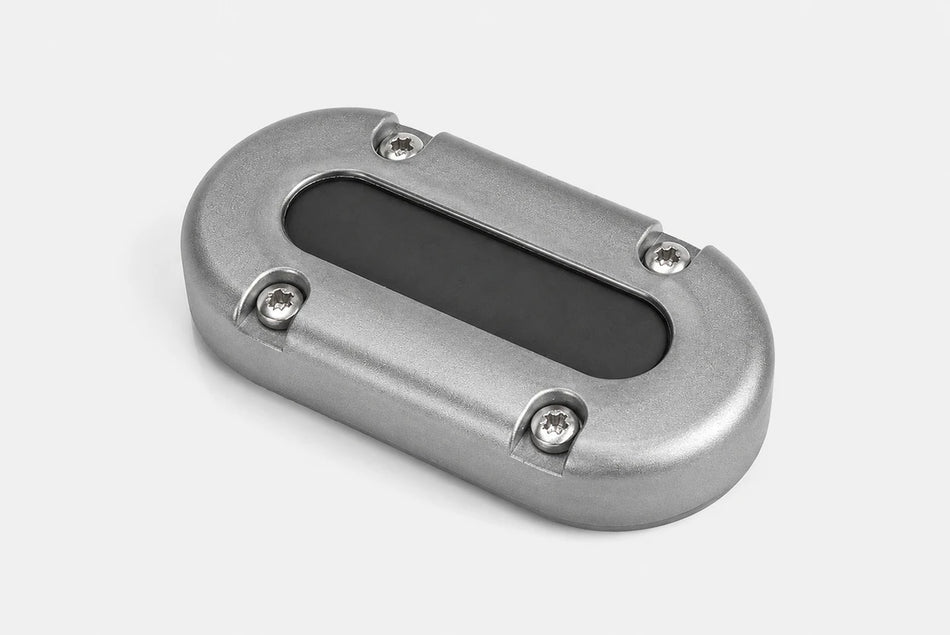 Empty aluminium vertical multi cable seal showing the internal rubber bung and mounting holes