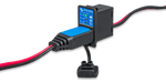 Victron battery indicator panel with status LEDs and charging cable plugged into the interface