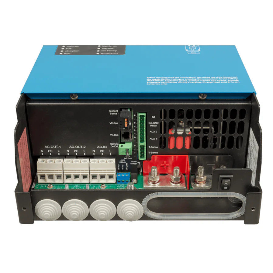 Internal view of connection terminals including AC input, AC outputs, and DC battery bolts